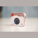 Promage Mini PC-50 pocket camera in cream, three-quarter view