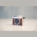 Promage Mini PC-80 three-quarter view showing the lens dial