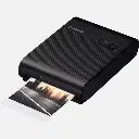 canon-selphy-square-qx10-portable-colour-photo-wireless-printer-premium-kit-black-product-left-slanted-view-with-printout.webp